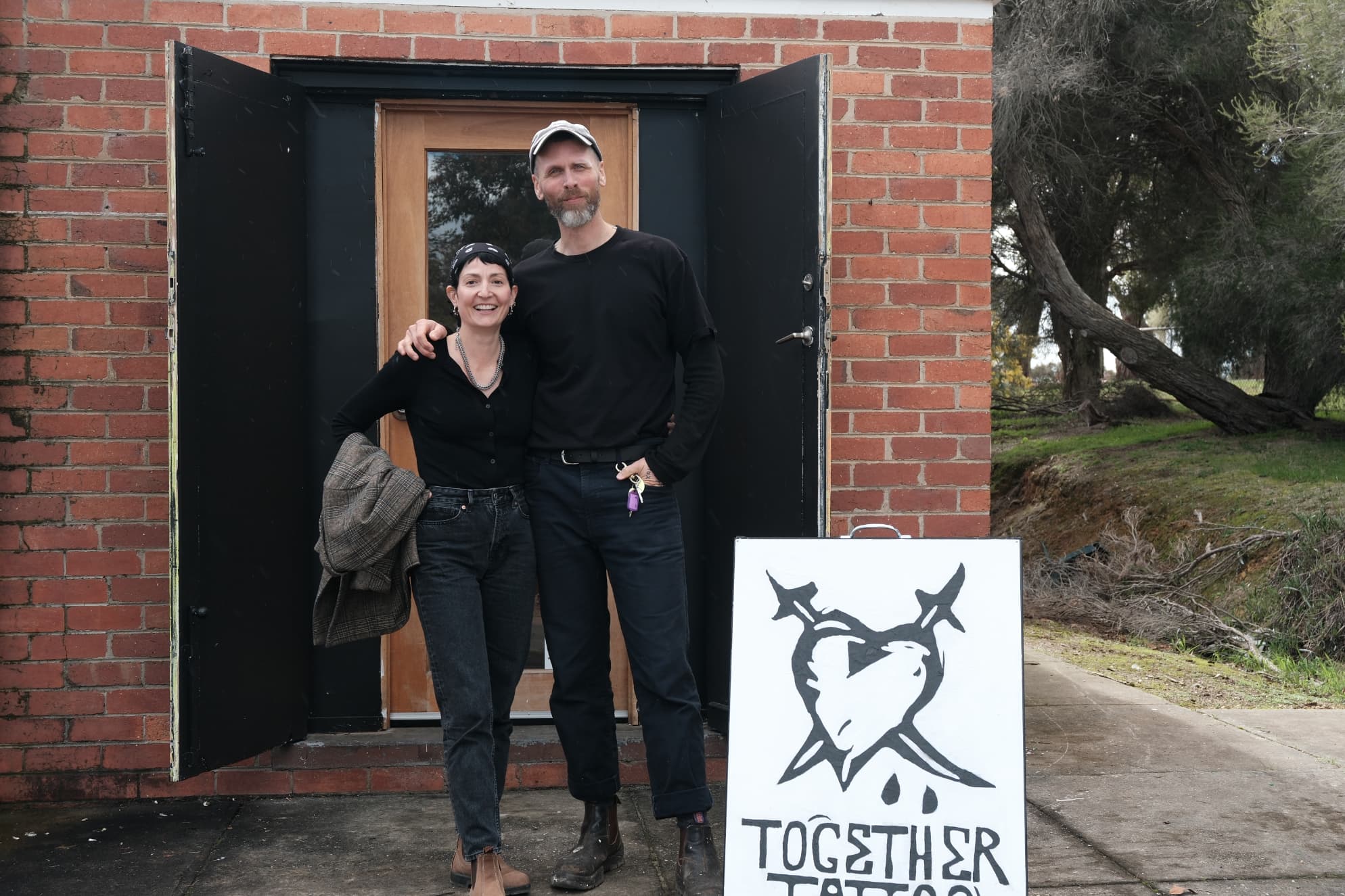 Pip and Jak outside Together Tattoo studio